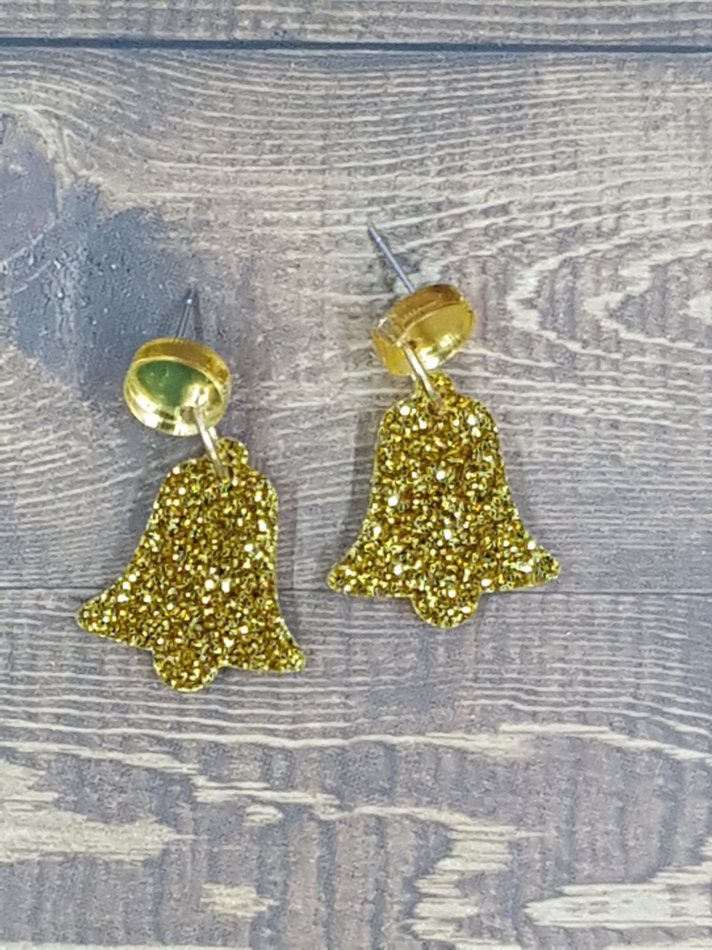 Laser-cut sparkly and glittery gold acrylic Christmas bell earrings with gold mirror circular topper