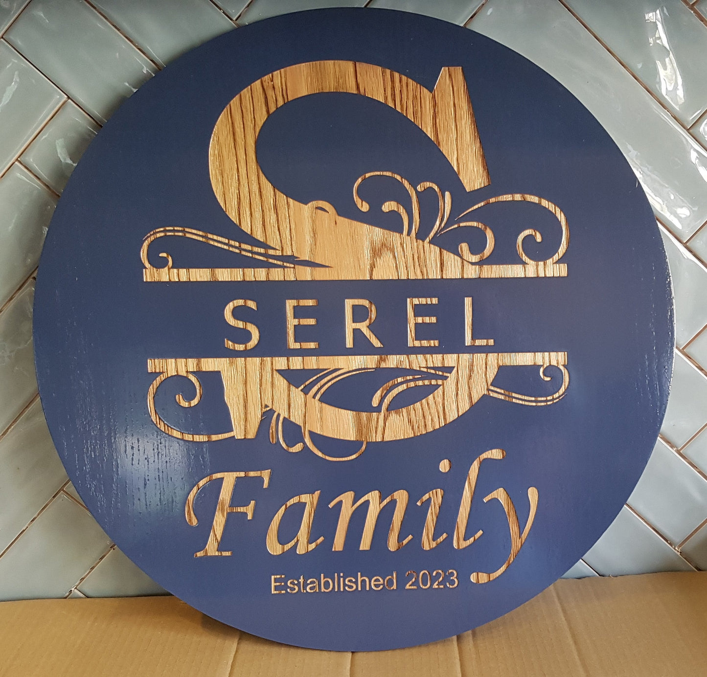 Personalized Laser Engraved Round Family Signs – Crafted Elegance for Timeless Memories. Whimsy split monogram with Famiily name and year couple were married. Stained in Deep Purple.