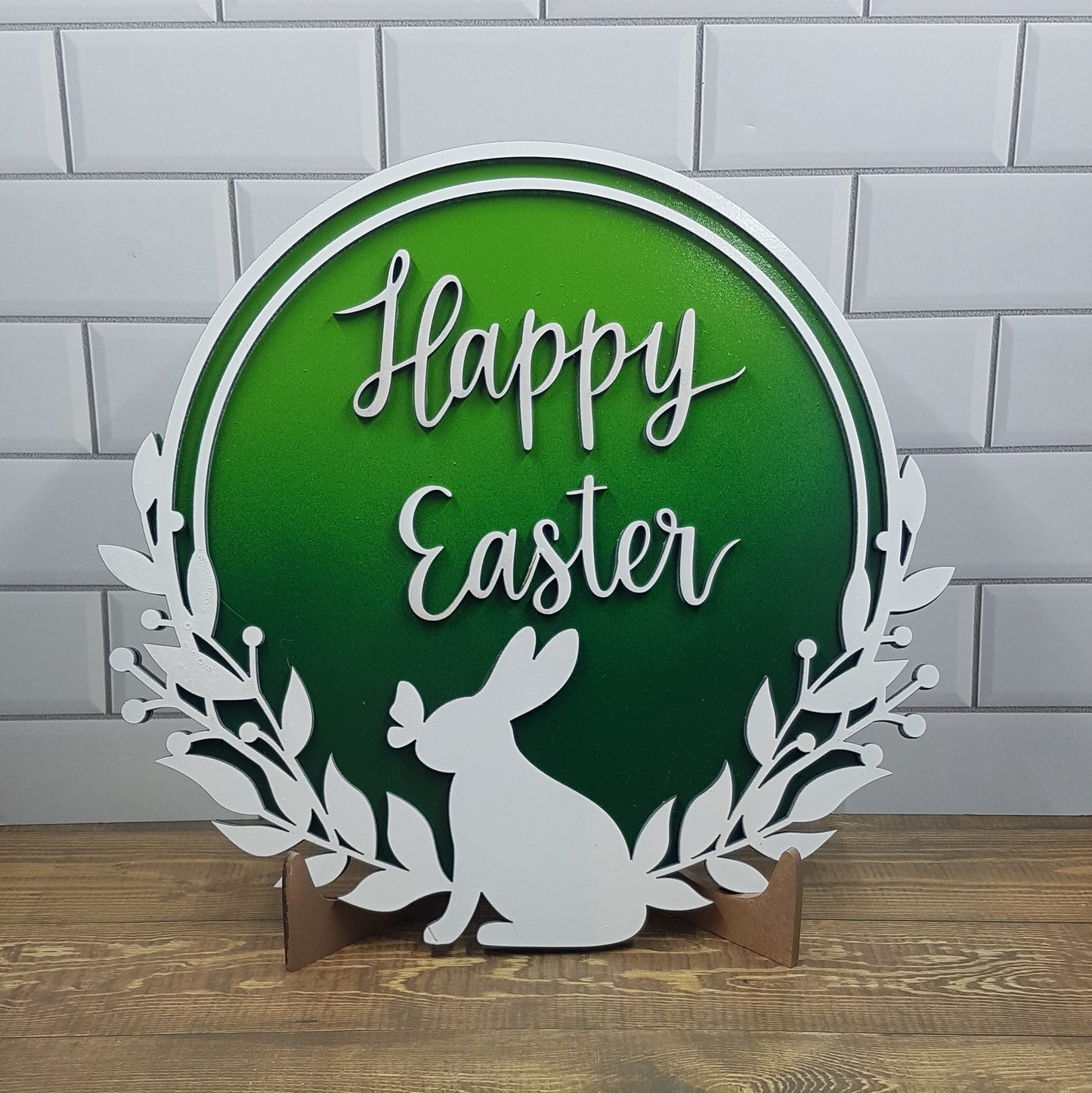 Elevate your Easter decor with our enchanting round Happy Easter sign. Featuring a charming bunny silhouette with a butterfly on its nose and the words "Happy Easter," this 21cm x 21cm round sign is available in five stunning 2-toned ombre effects. Perfect for spreading joy and celebrating the season