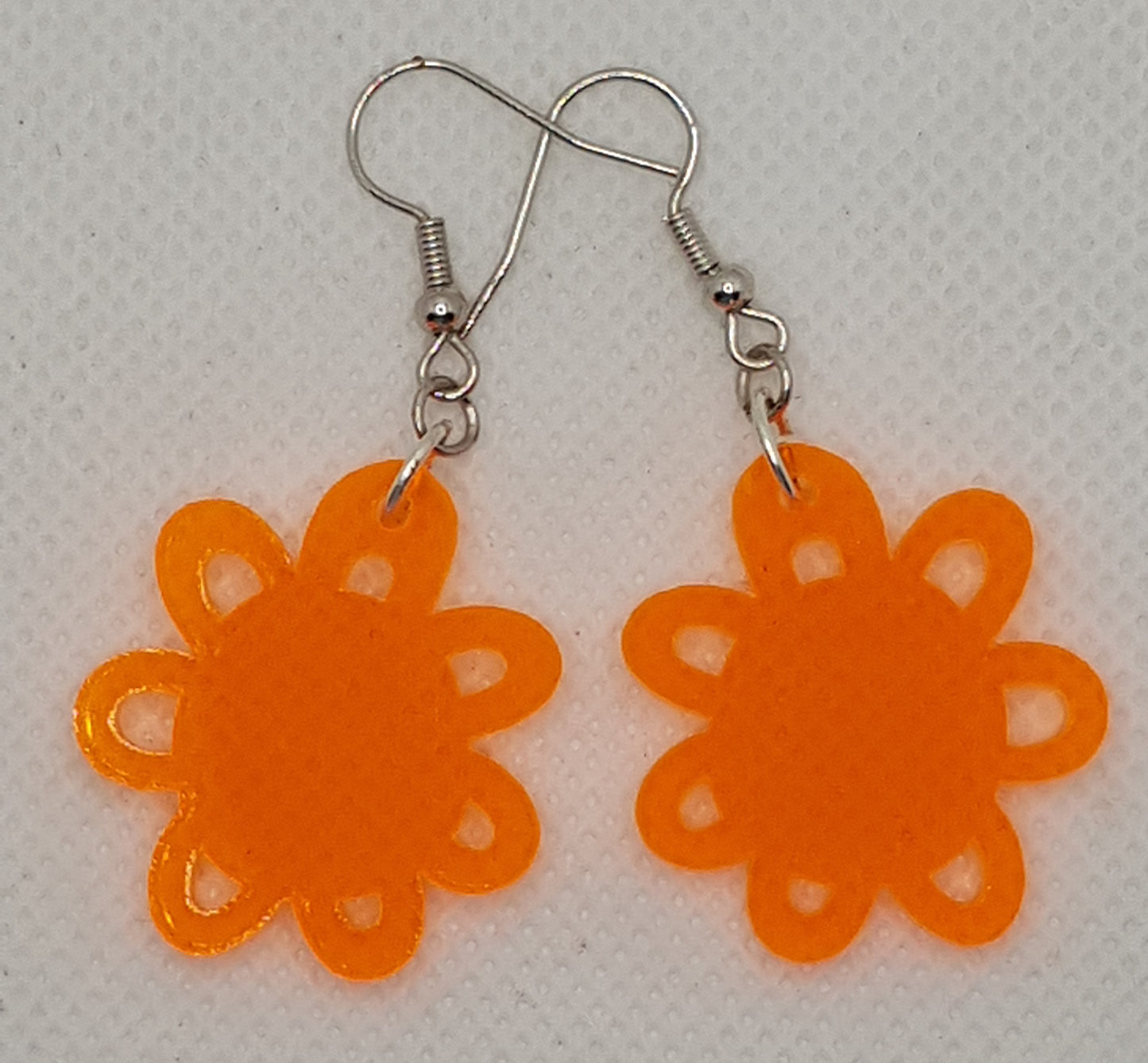 Acrylic Laser Cut Flower Earrings in Translucent Fluro Orange with Silver Plated Shepherd Hooks