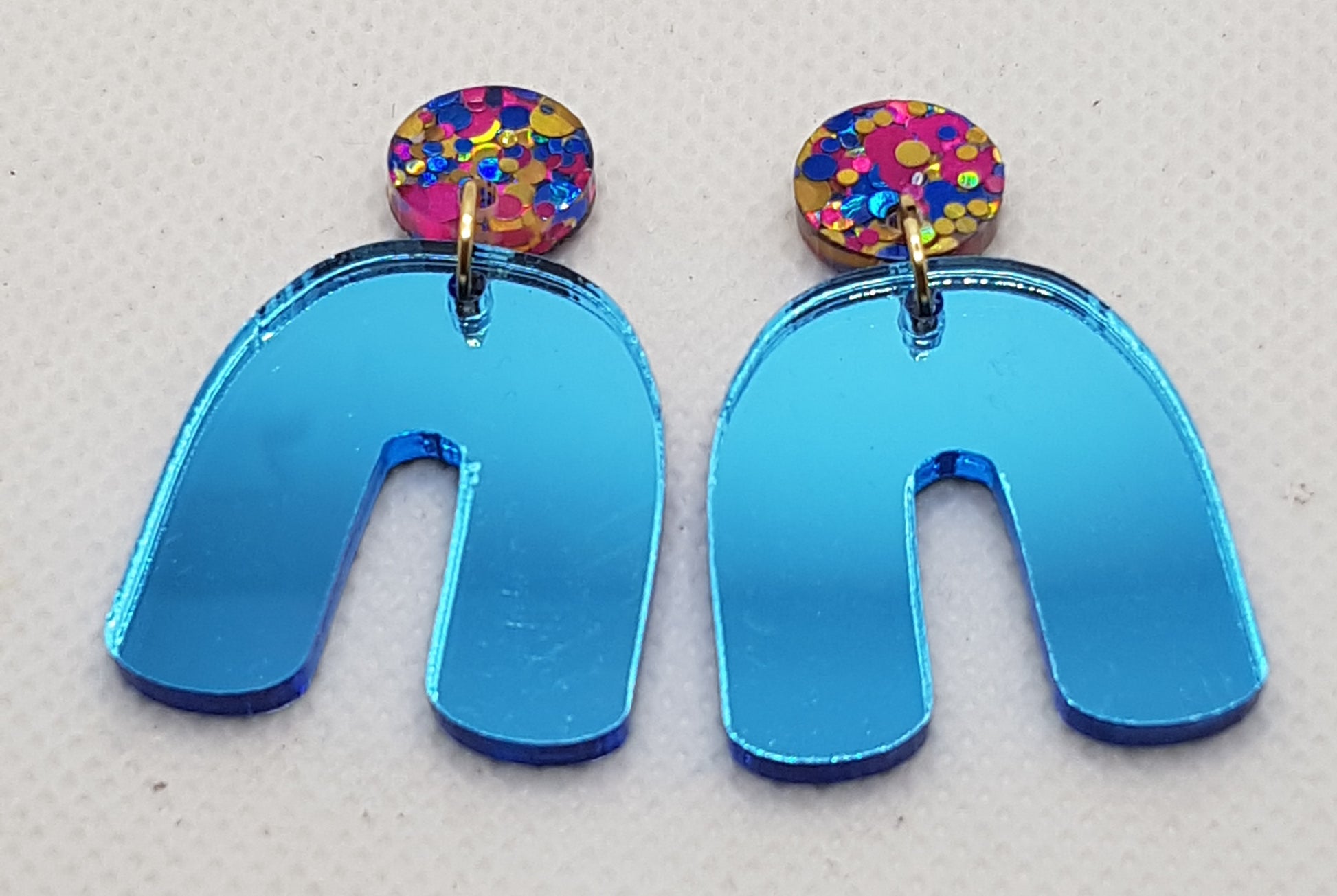 Mirrored Acrylic Laser Cut U Shape Earrings in Electric Blue with Rainbow Premiun Glitter Round Topper and Surgical Stainless Steel Stud