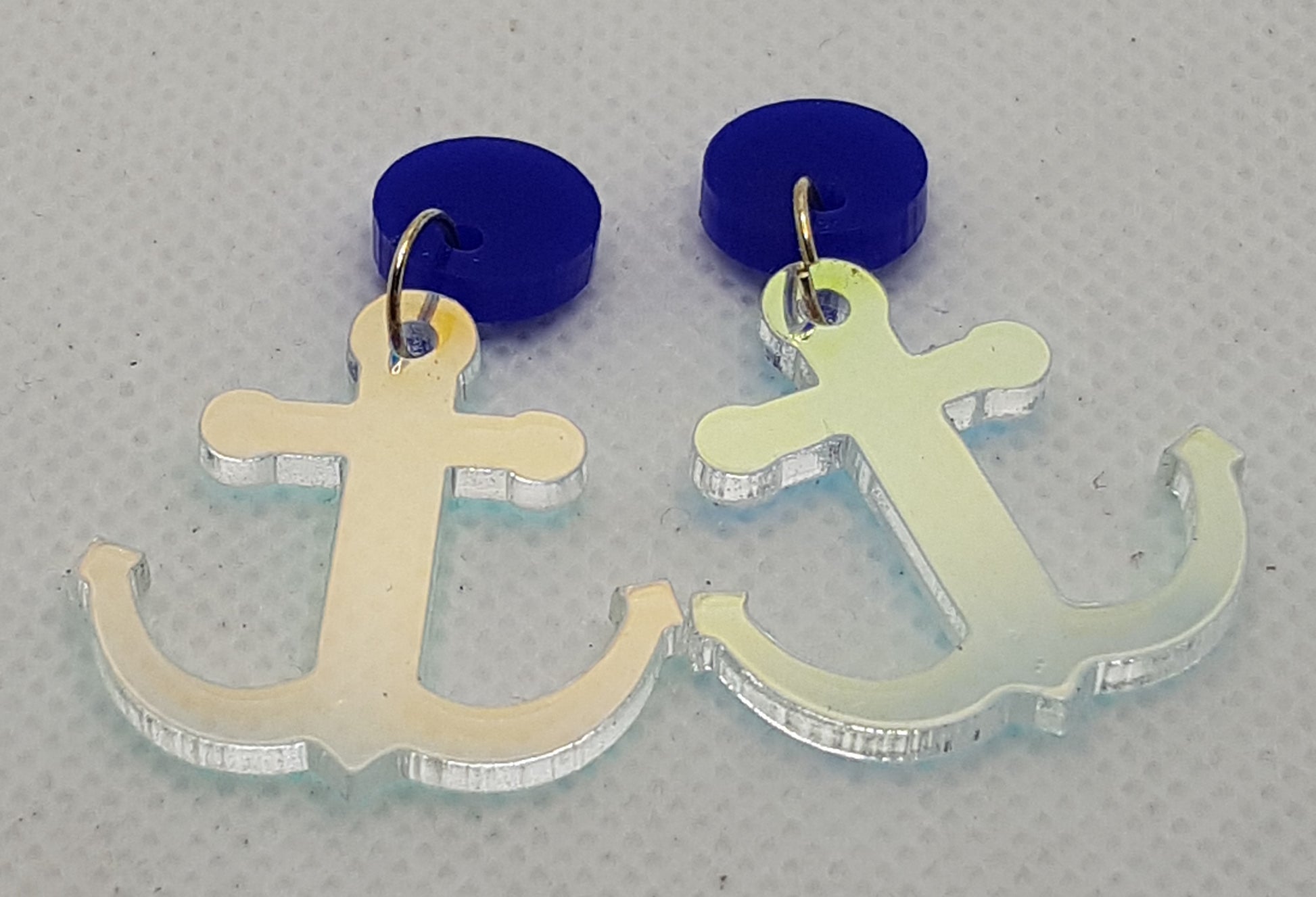 Iridescent Acrylic Laser Cut Anchor Earrings with plain Marine Blue Round Topper and Surgical Stainless Steel Stud.