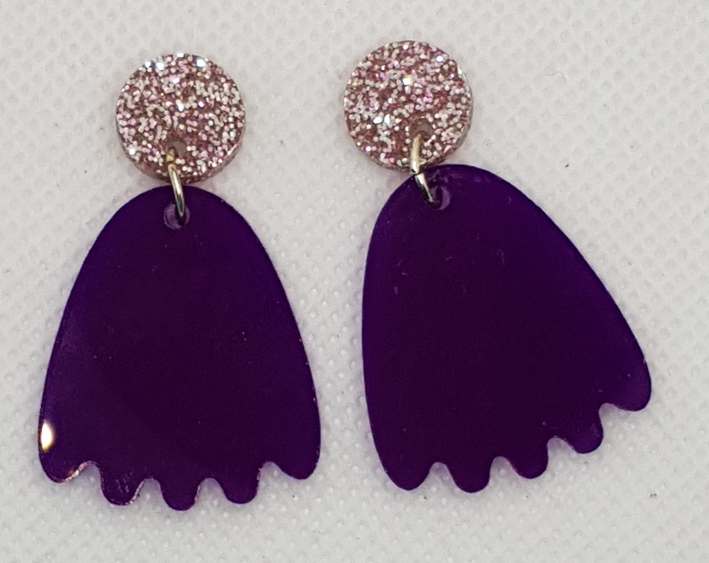 Acylic Laser Cut Pacman Ghost Earrings in translucent Royal Purple with circular pink glitter topper