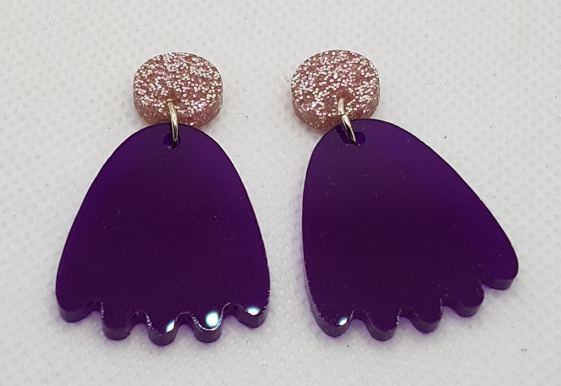 Acylic Laser Cut Pacman Ghost Earrings in translucent Royal Purple with circular pink glitter topper 2