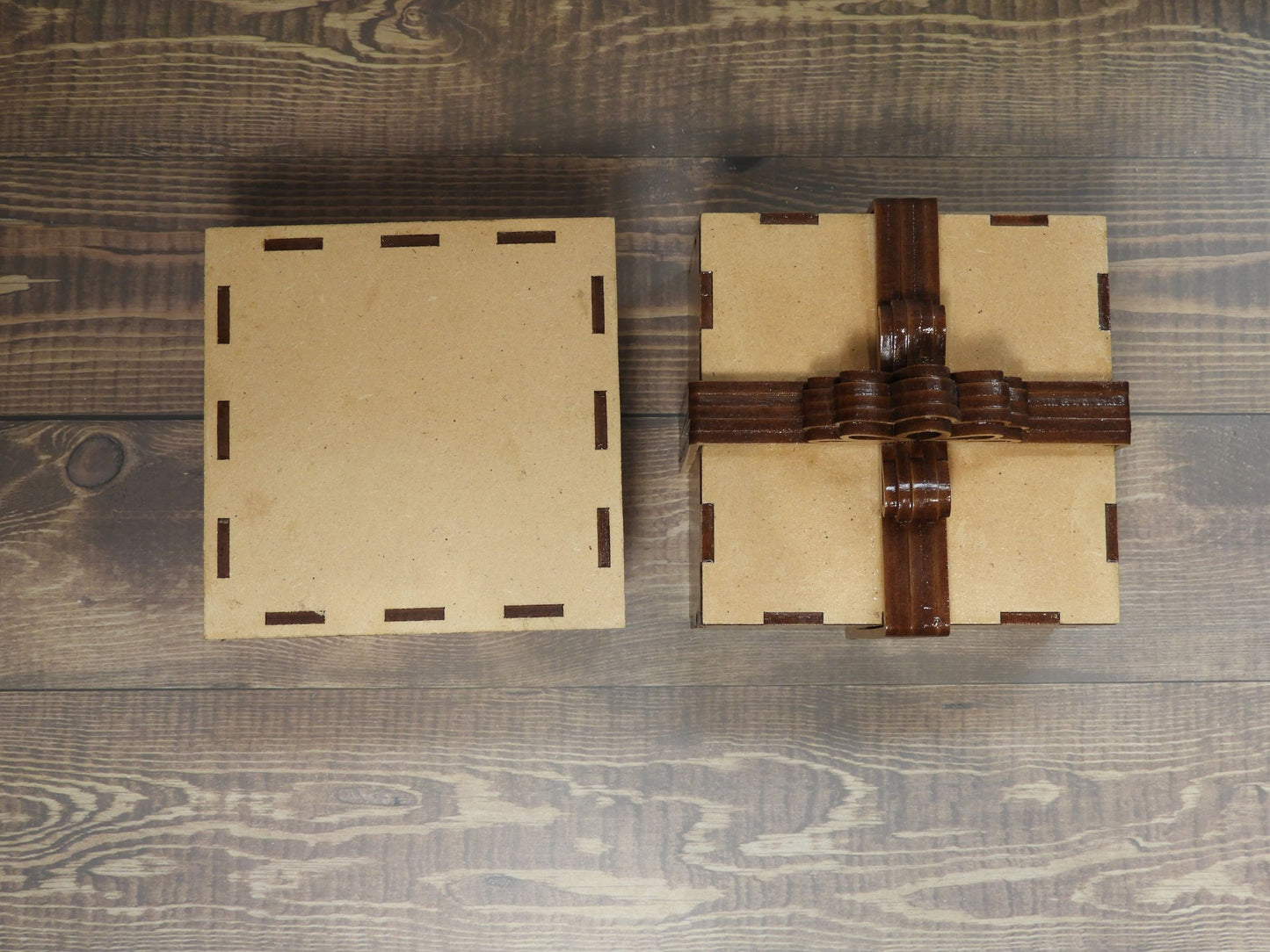 Laser cut timber bow box showing lid and underneath of base