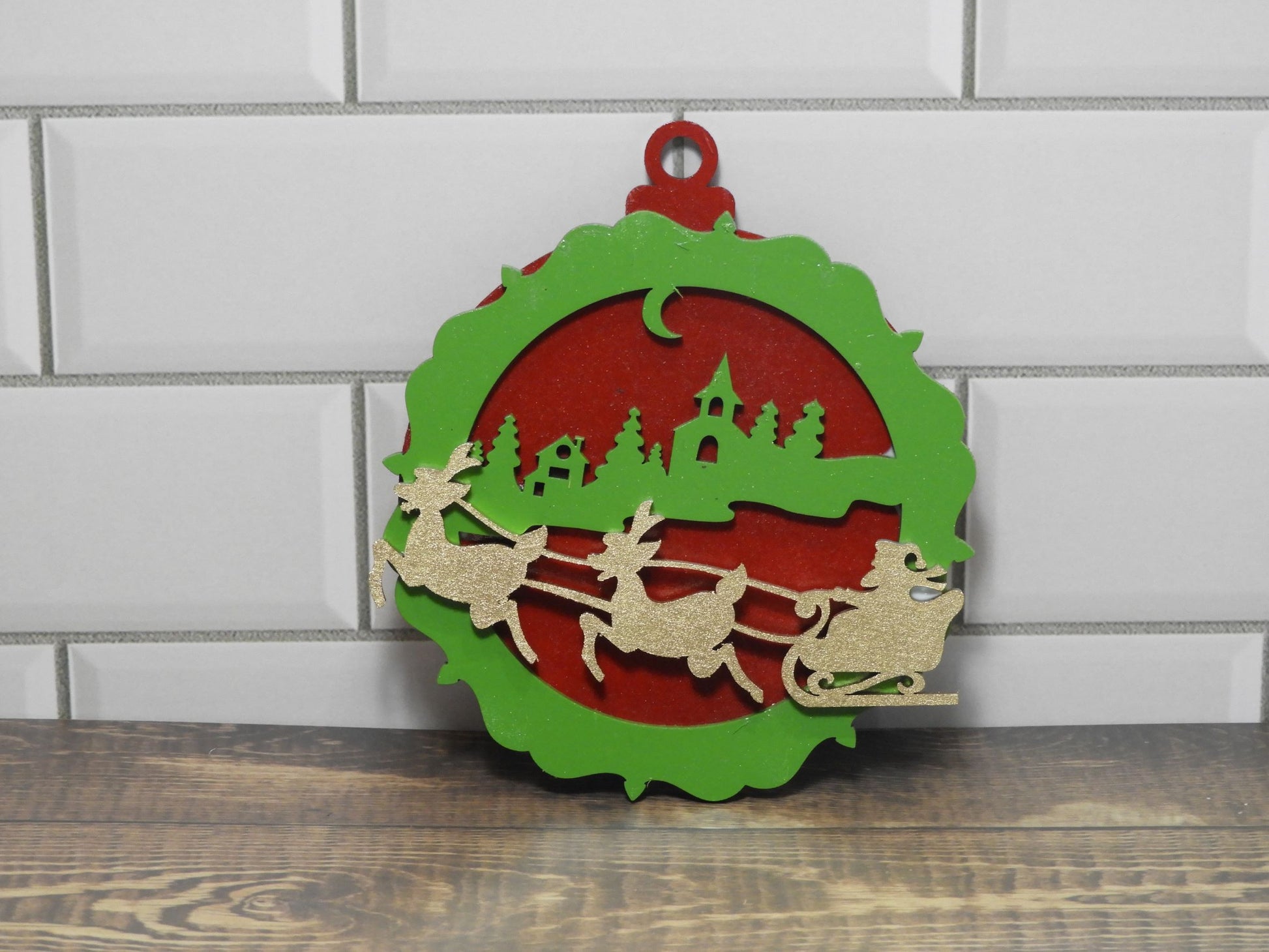 Painted laser cut timber Christmas Ornament, 3 layers in Red/Green/Gold assembled and viewed upright