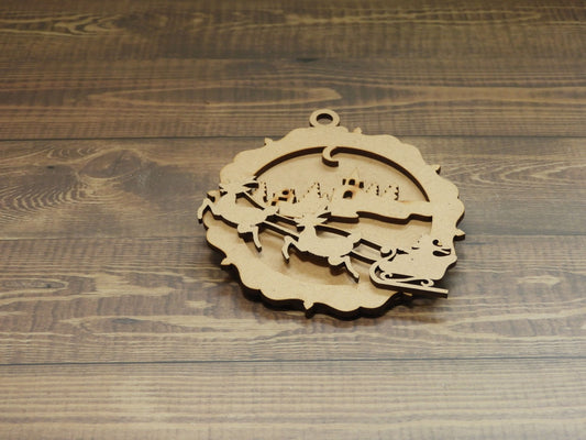 Raw laser cut timber layers Christmas Ornament - Sants flying over a Village on a bauble backing